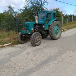 On my walk to and from work, I never know what I'll run across. When I saw this tractor, I knew I needed to take a photo. Anytime I see a tractor, it reminds me of back home and, specifically, my grandpa.